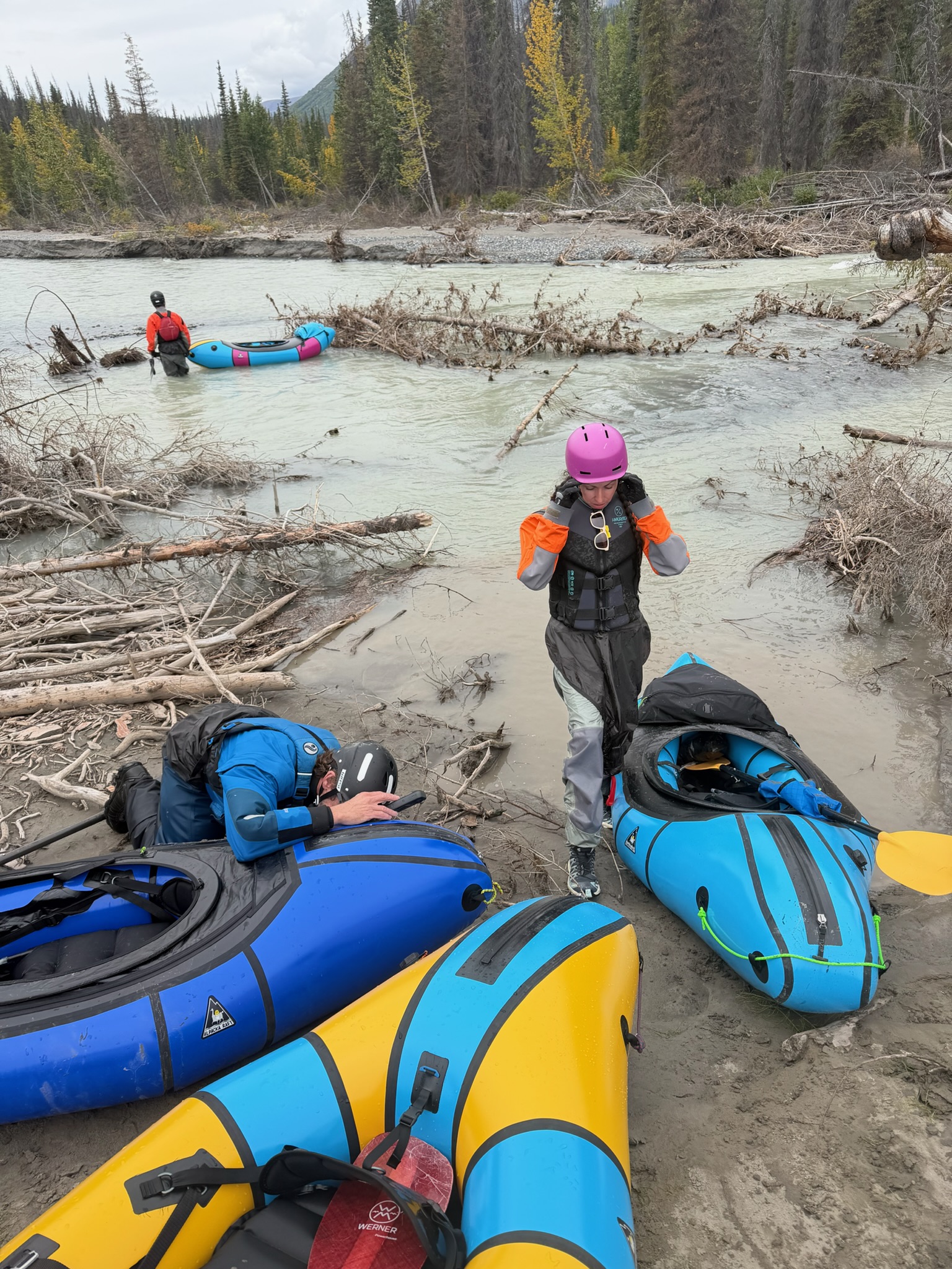Mona preparing for a packrafting day on a glacial river
